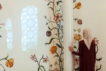 Young Muslim woman in the mosque.Lonely. focused on pray. The month of Ramadan.