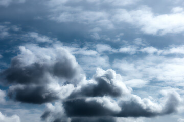 Stormy sky with rainy cumulus clouds. Moody dark blue thunderclouds. Beautiful thunderstorm landscape. Weather forecast concept. Abstract nature background.