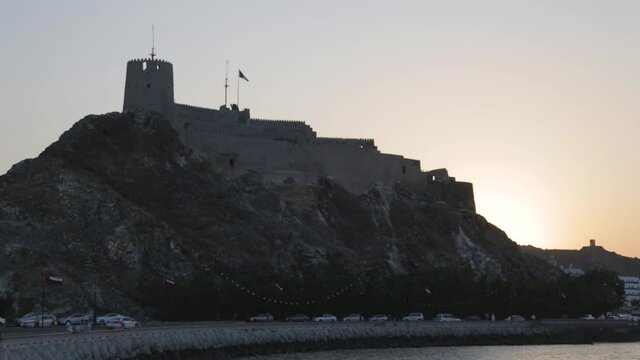 Image of Mutrah fort at the coast of Muscat during sunset, Gulf of Oman.