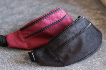 red and black waist bags