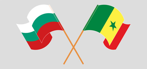 Crossed and waving flags of Bulgaria and Senegal