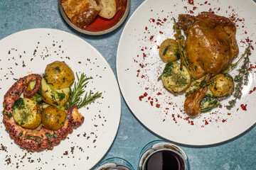 dinner at home - octopus with potatoes and chicken with a side, argentinean food to go 