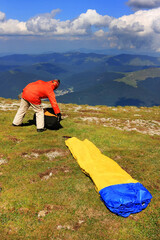 Paraglider prepareing to take off from a mountain