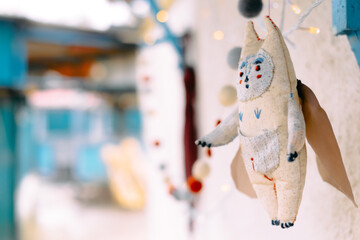 handmade snowman toy christmas decoration hanging on a thread