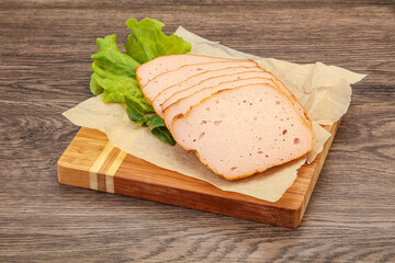 Boiled pork sausage over board