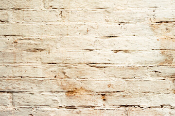 Texture of a brick wall with cracks and scratches which can be used as a background