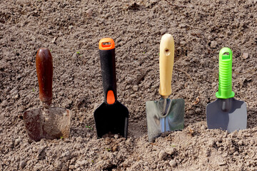 Tools for working in the garden. Four different garden paddles.