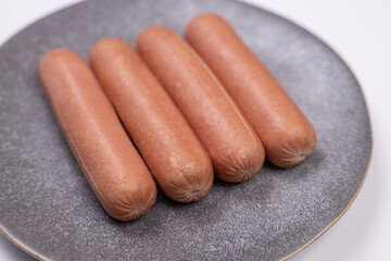 Cooked wienerwursts and served on the plate