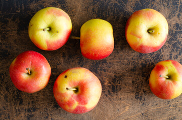 organic apples on abstract wooden background. Top view.