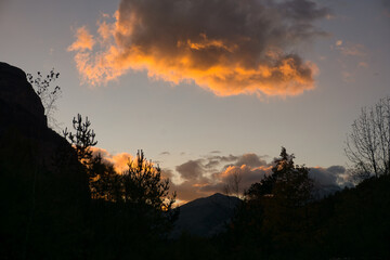 sunset in the meadow of the Ordesa y Monte Perdido National Park, in the Aragonese Pyrenees,...