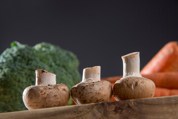 White mushroom on wood cutting board