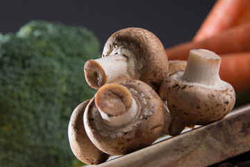 White mushroom on wood cutting board