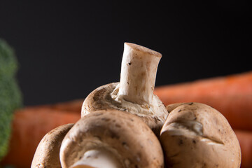 White mushroom on wood cutting board
