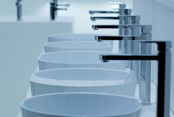 modern white ceramic washbasins and taps