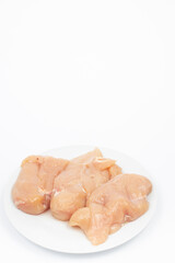 Raw Chicken Breasts on the plate above white background