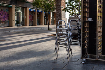 street cafe chairs before opening of the terrace