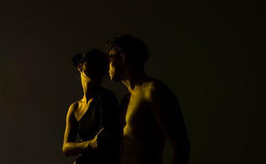Sexy photo. Erotica. Couple love. Fashion studio photo of beautiful sensual couple posing together