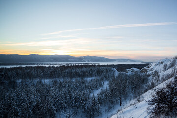 Fototapeta na wymiar sunrise over the mountains near cold river