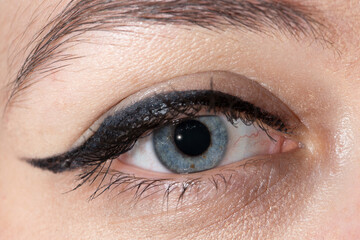 Obraz premium Detail of a calm human eye, visible iris, woman, eye lines, flash