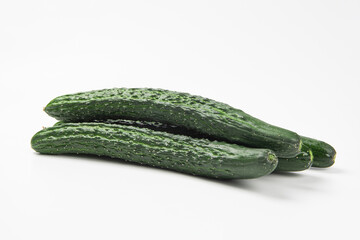 Fresh green cucumber on white background.