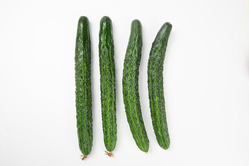 Fresh green cucumber on white background.