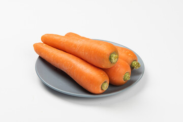 Fresh carrots isolated on white background