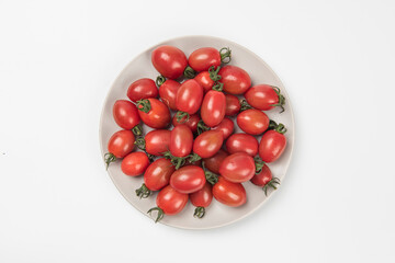 Fresh cherry tomatoes isolated on white background