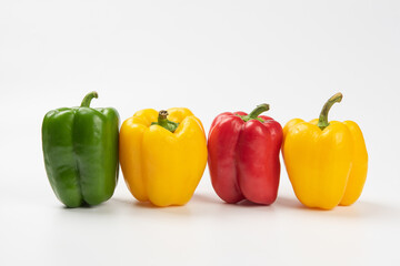 Fresh ripe color peppers isolated on white background