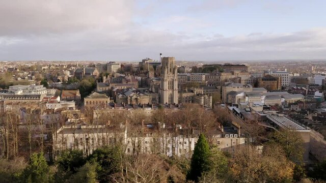 Aerial tracking past Bristol University and Wills Memorial building before revealing Cabot Tower in the foreground