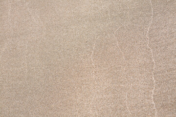 Fototapeta na wymiar 渚の砂浜に残る波の紋 
