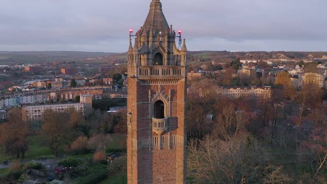Bristol aerial view of Cabot Tower with rows of pretty residential houses and Clifton Suspension Bridge appearing in the background