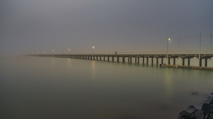 Fototapeta na wymiar Foggy morning at the Urangan Pier at Hervey Bay, Queensland, Australia