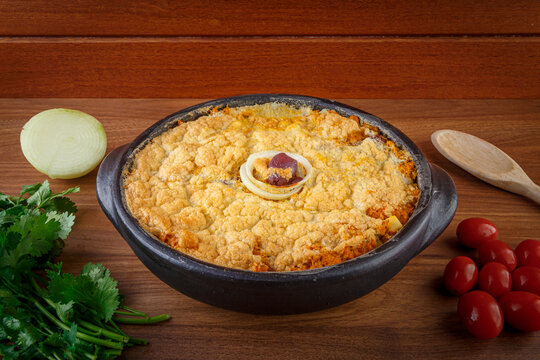 Vegetarian homemade pie, olive with tomatoes, onion and vegetables. Complete seafood - Torta Capixaba.