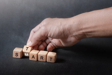 hand holding dice with text for illustration of "Start smart" words
