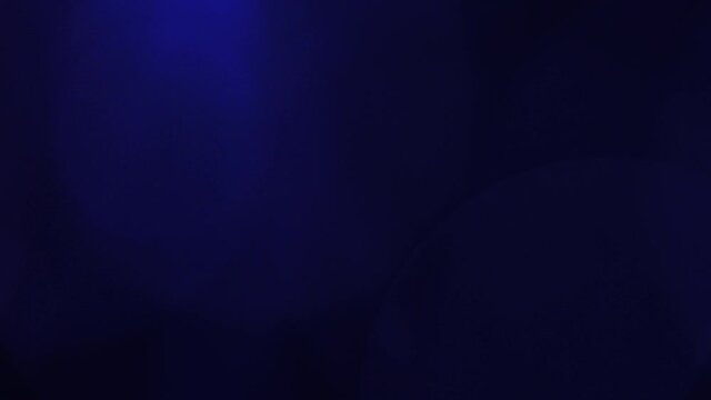 Background - subtle blue lens flare - abstract shapes on dark background