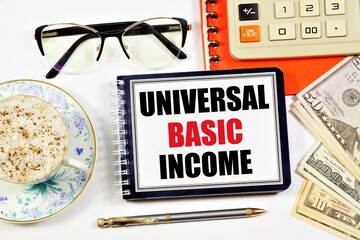 Universal basic income. A text label in the planning notebook. A successful financial management...