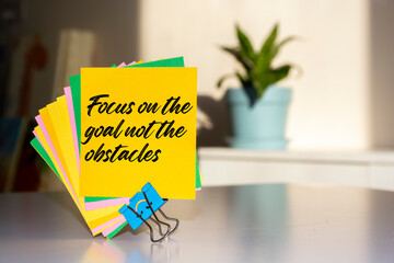 Inspirational motivational quote. Focus on the goal not the obstacles.