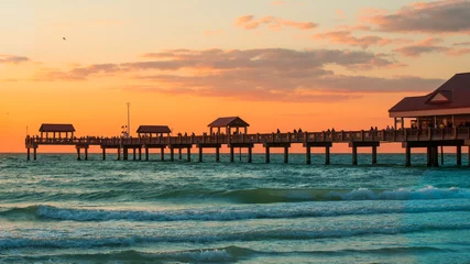 Foto auf Acrylglas Clearwater Strand, Florida Fishing pier. Spring break or Summer vacations. Clearwater Beach Pier 60. Ocean or Gulf of Mexico. Florida paradise. Tropical nature. Beautiful ocean sunset. Good for travel agency.