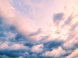 Fototapeta na wymiar Blue and orange sky background with clouds in summer
