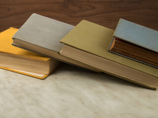 Old shabby books on light table
