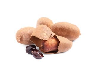 Delicious ripe tamarinds and seeds on white background. Exotic fruit