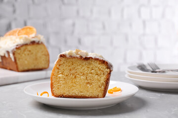 Cut delicious sweet cake on light grey marble table