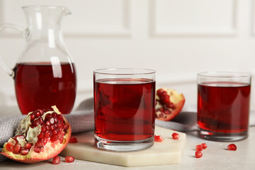 Freshly made pomegranate juice on light table