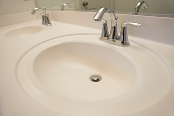 Close up on white bathroom double sink