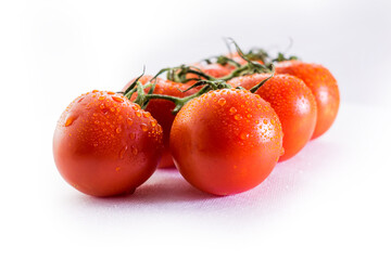 Red tomatoes on white background
