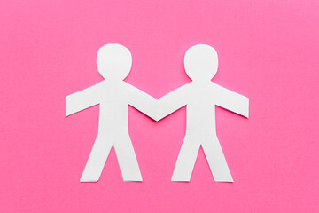 Paper human figures on color background