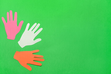 Paper human palms on color background