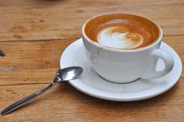 Hot cappucino in white cup to make the day