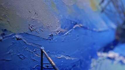 Artist copyist paint seascape with ship in ocean. Craftsman decorator draw as boat sail on blue sea with acrylic oil color. Draw finger brush palette.