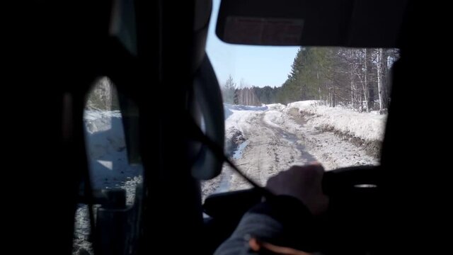 Driving a car in the first person. driving on a winter ice road.